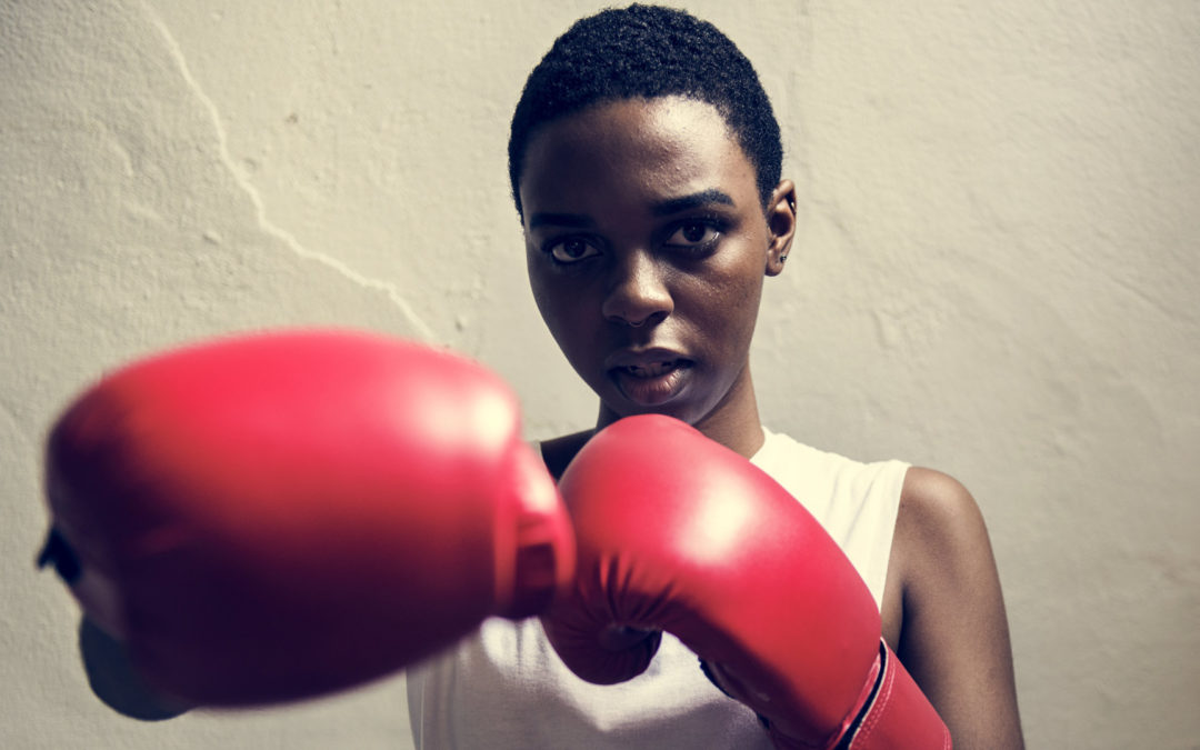 Woman wearing boxing gloves