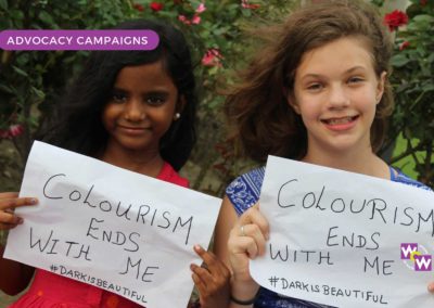 Two girls taking part in the Dark Is Beautiful advocacy campaign for Colourism Ends With Me
